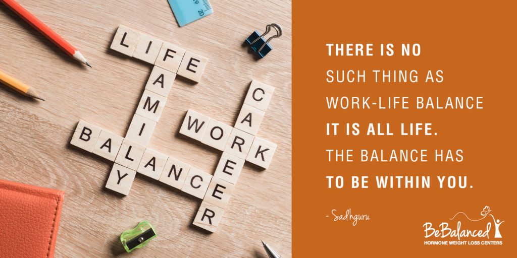 The words 'life' 'family' 'balance' 'work' and 'career' made of wooden letters