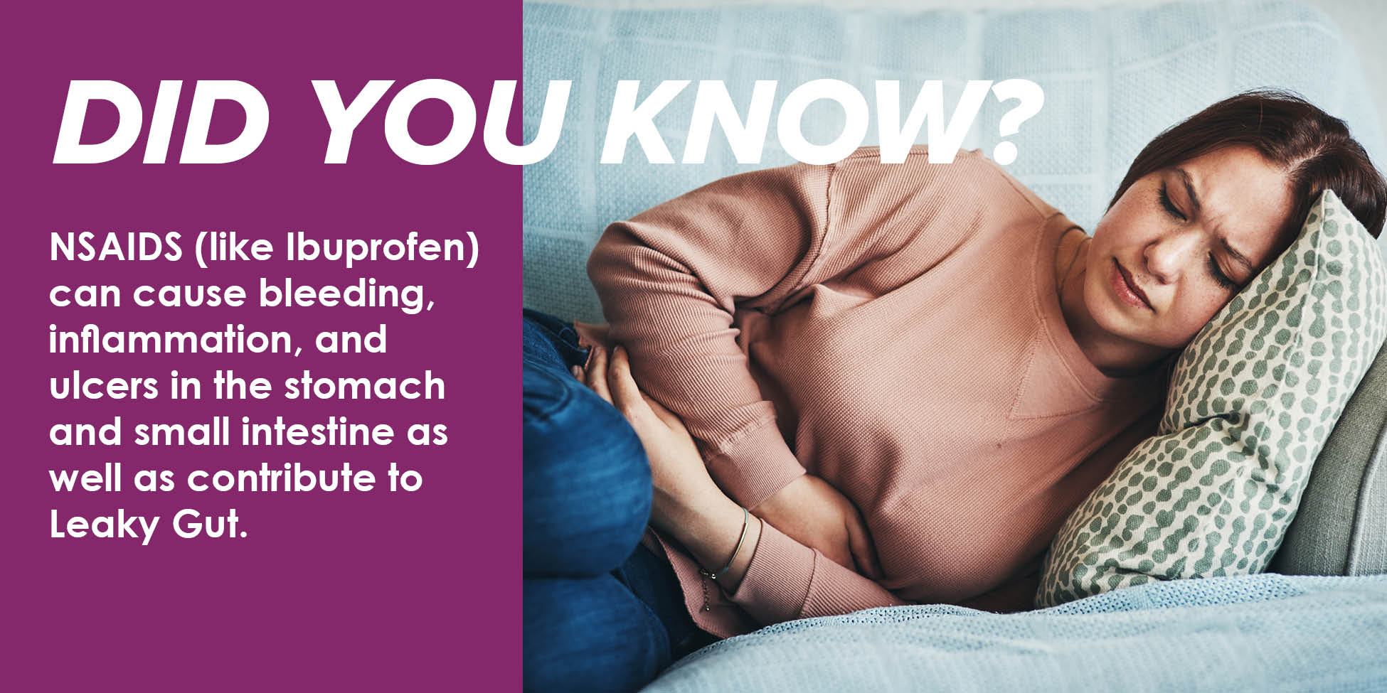 Woman lays down and holds stomach in pain