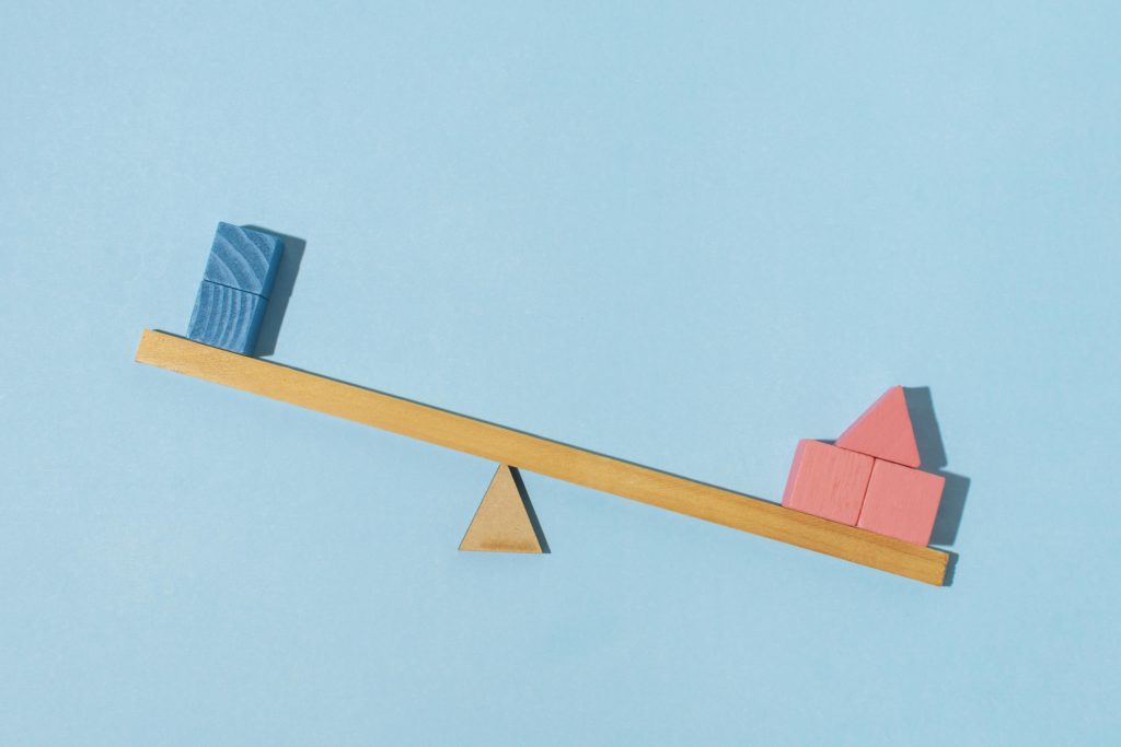 wooden scale with blue and red blocks on both sides