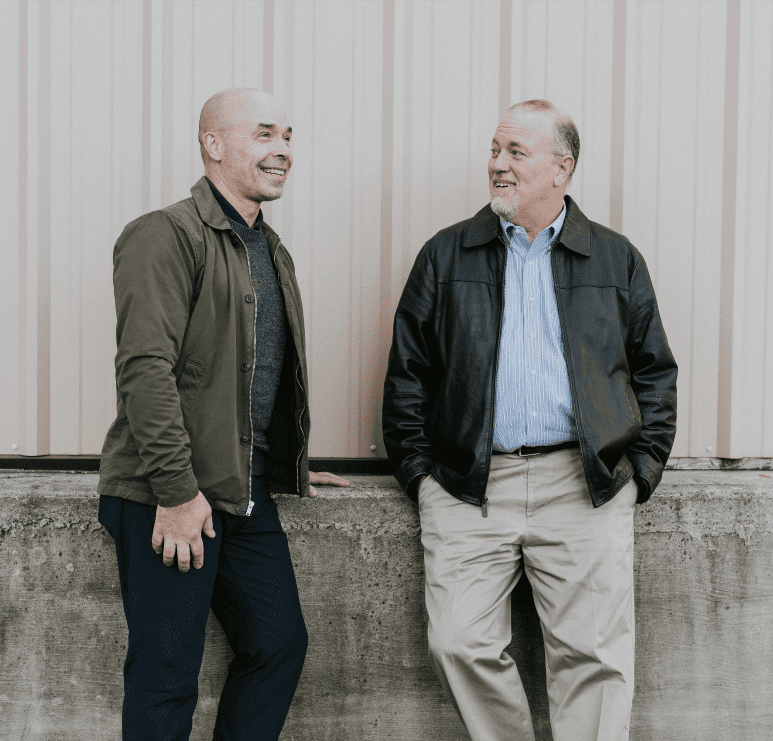 Two men with balanced hormones stand together