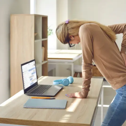 Woman with endometriosis holds back