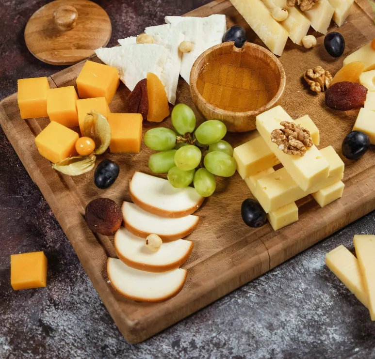 charcuterie board laid out with apple slices, cheese, grapes, and more for phase 1 of becoming balanced weight loss program