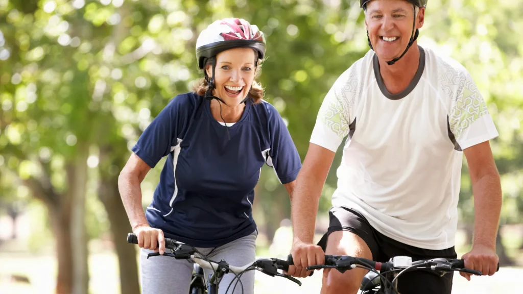 Couple biking together on a scenic nature trail
