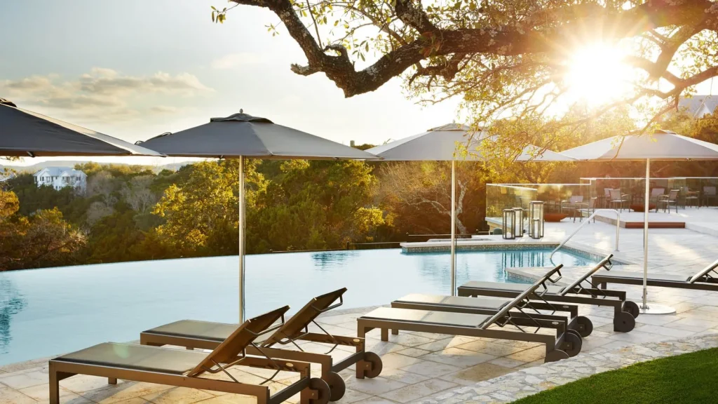 swimming pool with golden hour sunshine at the Miraval Resort Spa in Austin Texas